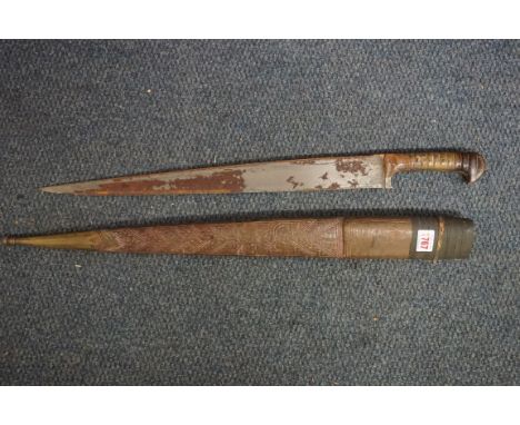 An antique yatagan and leather scabbard, having 49.5cm blade.IN-HOUSE SHIPPING IS NOT AVAILABLE ON THIS ITEM. 