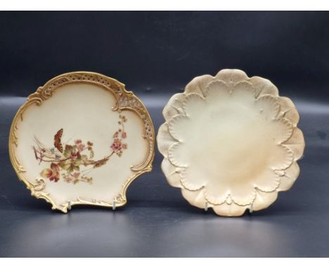 Two Royal Worcester blush ivory plates, the first circa 1891, shape no. 1426, painted with a butterfly amidst flowers, 22cm w