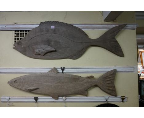Two Folk Art carved oak fish, comprising: a salmon, inscribed 'Sarah Parish, 2000' verso, 97cm long; and a carp, 105.5cm long
