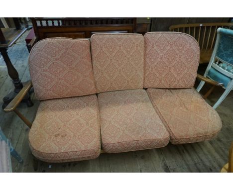 An Ercol three seater Windsor settee, 173cm wide. 