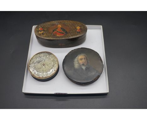 A Stobwasser style circular box and cover, the&nbsp;cover painted with a bust length portrait of a cleric, 10.5cm diameter;&n