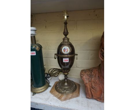 A patinated brass table lamp, on onyx base, total height 48.5cm. 