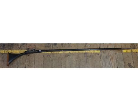 An antique Arab flintlock musket, 201cm.IN HOUSE SHIPPING IS NOT AVAILABLE ON THIS ITEM.  