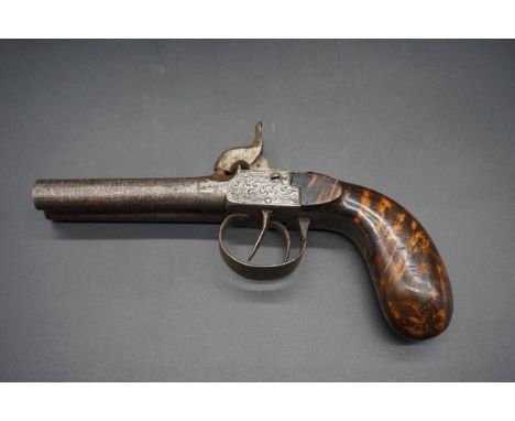 A 19th century double barrel percussion pistol, with 8cm Damascus style barrels and floral scroll decorated lock plates, waln