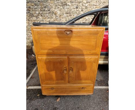 An Ercol bureau, 82.5cm wide x 43cm deep x 110cm high. 