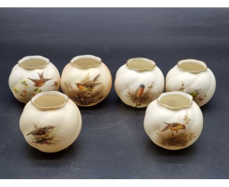Three Royal Worcester and three Grainger &amp; Co ovoid vases, each painted with a bird, 7cm high. (6) 