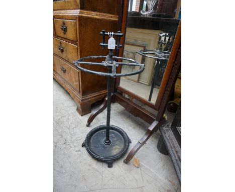 A black painted cast iron circular stick stand, with simulated bamboo moulding, 31cm diameter.&nbsp; 