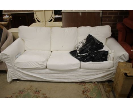 A MODERN IKEA THREE SEATER SOFA WITH LOOSE COVERS