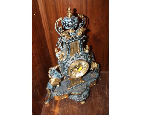 A LARGE MODERN BRASS MANTLE CLOCK WITH TWIN HORSE FINIAL 