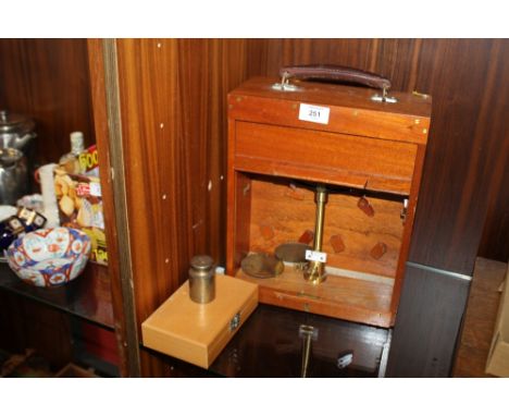 A CASED SET OF AVERY SCALES TOGETHER WITH A BOX OF WEIGHTS 