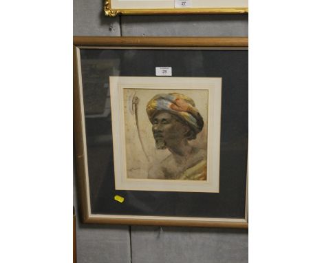 AN INDISTINCTLY SIGN FRAMED AND GLAZED WATERCOLOUR PORTRAIT OF A NORTH AFRICAN GENTLEMAN