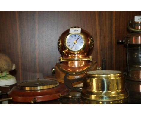 A MODERN DIVERS HELMET SHAPED CLOCK TOGETHER WITH A MODERN BULK HEAD CLOCK AND A BAROMETER (3) 
