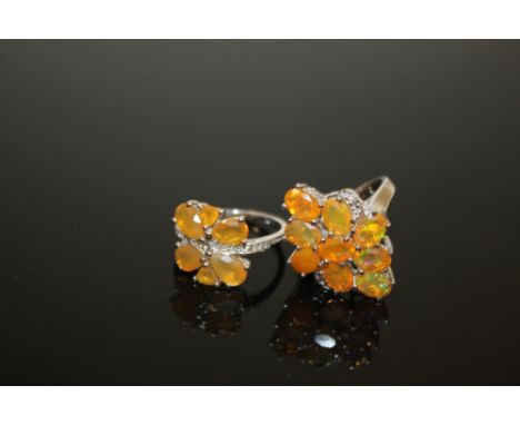 TWO STERLING SILVER AND FIRE OPAL SET DRESS RINGS 