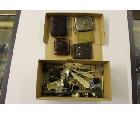 A box containing cigarette cases; costume jewellery; caddy spoons; fans etc.
