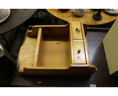 A small pine wall shelf fitted two drawers