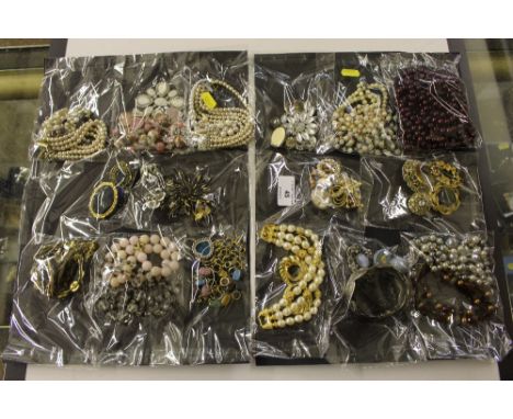 A collection of costume jewellery to include a bangle; brooches; bead necklaces; a cameo brooch etc.