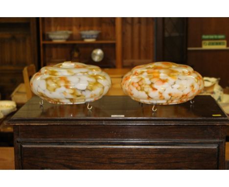 A pair of mottled glass light shades