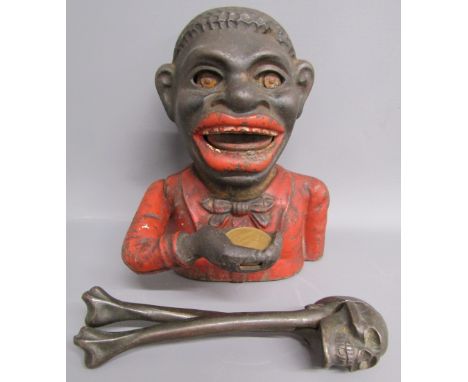'Jolly Nigger Bank' money box and skull & cross bones nut cracker  Notice from the the-saleroom.com: These items are listed o