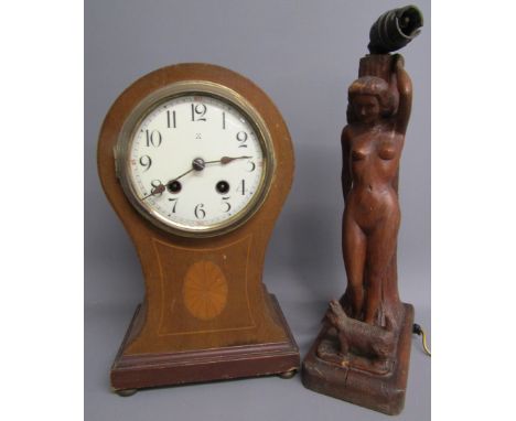 Carved wooden table lamp in the form of a nude lady and her dog and an inlaid balloon mantel clock possibly Hamburg -&nbsp; c