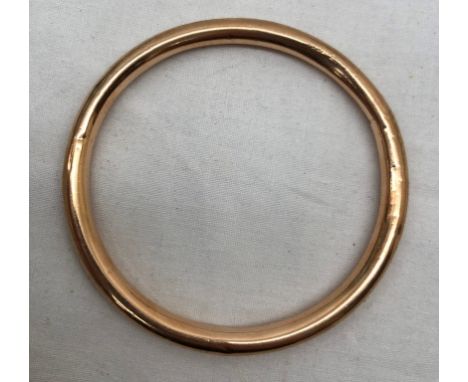 A 9ct gold bangle
