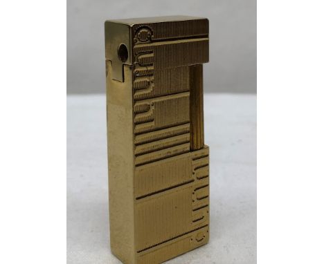 A gold-plated lighter, marked Dunhill