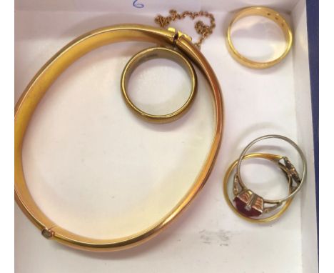 A 9ct gold bangle; together with rings