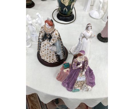 A Coalport figure: Queen Victoria with Royal Worcester figures of Mary Queen of Scots and Queen Elizabeth