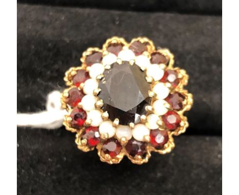 A 9ct opal and garnet dress ring