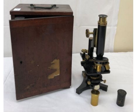 A vintage microscope by R &amp; J Beck Ltd with lenses by J Swift &amp; Son