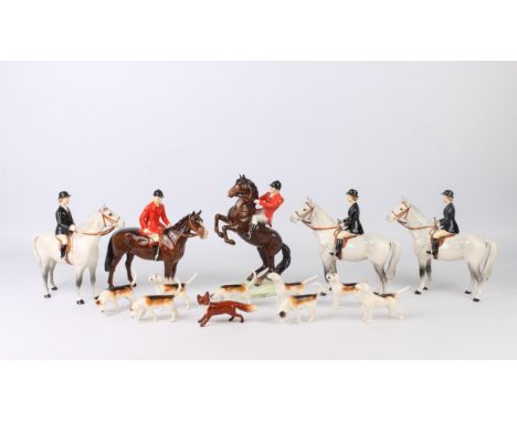 A collection of fourteen Beswick hunting figures - with impressed and black printed factory marks, comprising an 868 Huntsman
