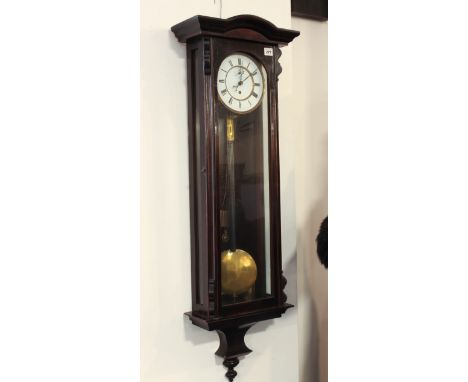 A Vienna style stained wooden wall clock - early 20th century, with 30 hour movement, Roman white enamel and brass dial, the 