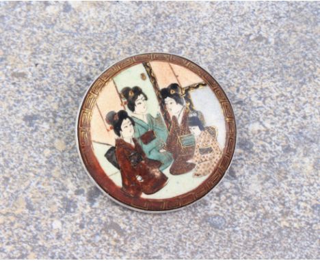 A vintage Japanese silver and Satsuma brooch - 1920s-30s, the circular brooch painted with three ladies and a child in an int