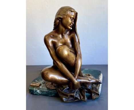 A modern bronze of a seated female nude - by Manuel Vidal Torrens, for Ebano Int., light golden brown patination, signed to b