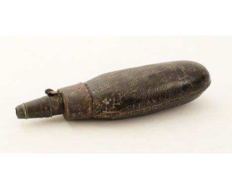 An 18th / early 19th century leather, bronze and steel powder or shot flask - the spring steel hinged lever in working order,