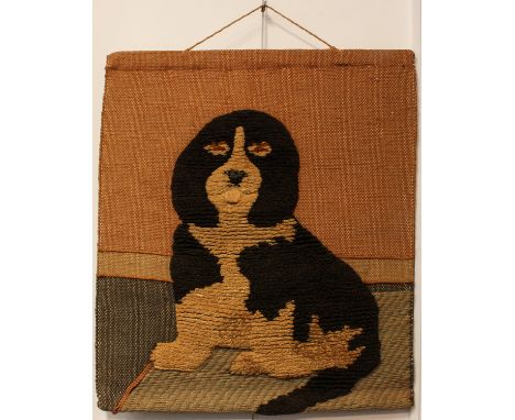 A vintage woolwork and jute wall hanging depicting a spaniel dog - 1960s-70s, 81 x 71 cm, some age staining.