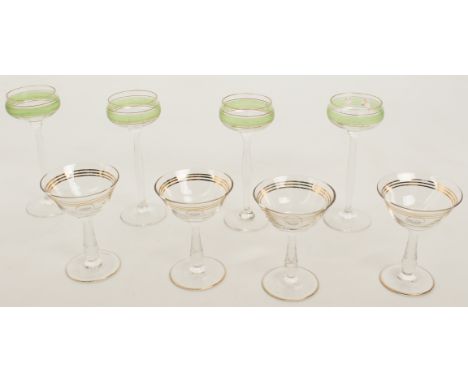 A set of four Secessionist-style tall liqueur glasses in the style of Peter Behrens - the shallow, cupped bowls with bands of