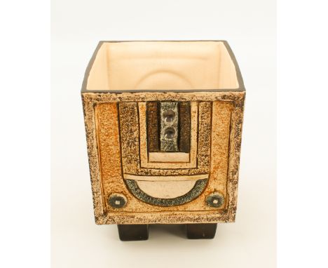 A Troika pottery cube vase by Jane Fitzgerald (1976-83) - decorated with geometric designs to two sides, on a light brown gro