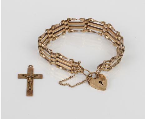 A vintage 9ct gold gatelink bracelet - hallmarked London 1979, with heart padlock clasp; together with a 9ct gold crucifix pe