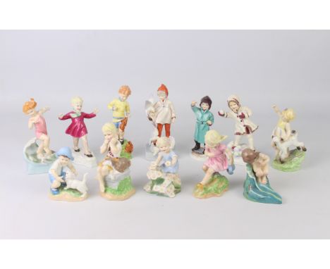 A set of twelve Royal Worcester 'Months of the Year' figures - modelled by Freda Doughty and with black printed factory marks