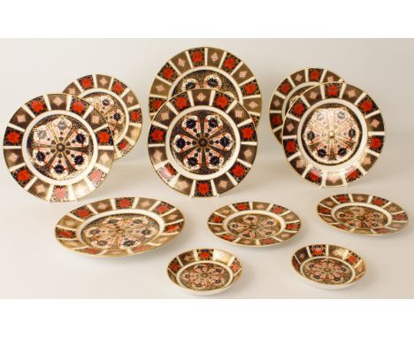 A graduated set of nine Royal Crown Derby 'Old Imari' plates - pattern 1128, comprising a&nbsp;27 cm plate, six 21.5 cm plate