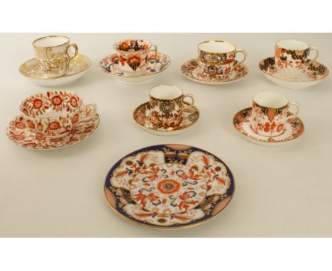 Seven 19th and early 20th century coffee cans, teacups and saucers and an Imari palette side plate: three by Royal Crown Derb