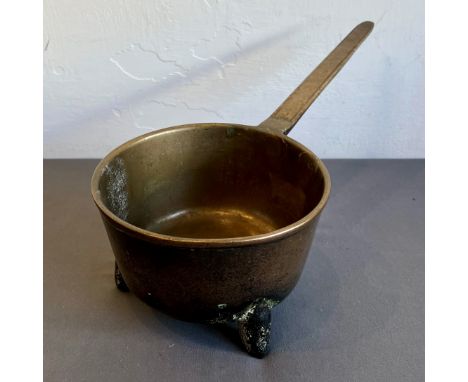 A bronze sauce pan