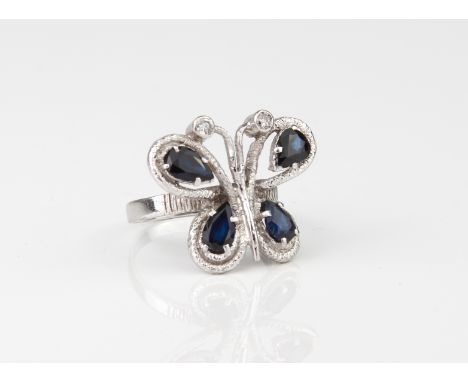 A vintage 18ct white gold, sapphire and diamond butterfly ring - hallmarked London 1979, the openwork, bark effect butterfly 