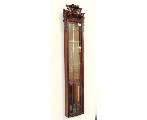 A late Victorian carved oak Admiral Fitzroy barometer by Field &amp; Son of Birmingham - with red and black printed paper sca