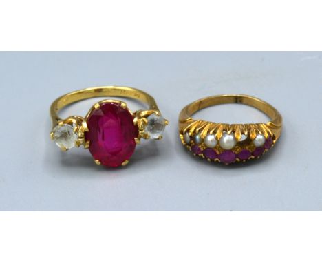 A yellow metal Amethyst and pearl set dress ring together with a three stone ring