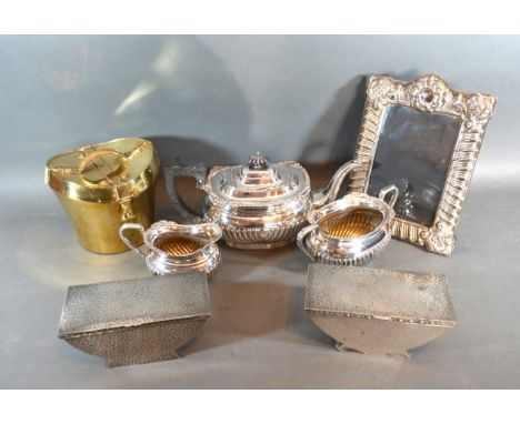 A Silver Plated Three Piece Tea Service together with a rectangular photograph frame, a pair of pewter boxes and a brass ice 