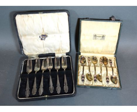 A Set of Six Birmingham Silver and Enamel Decorated Teaspoons from Liberty together with a set of six Sheffield silver cake f