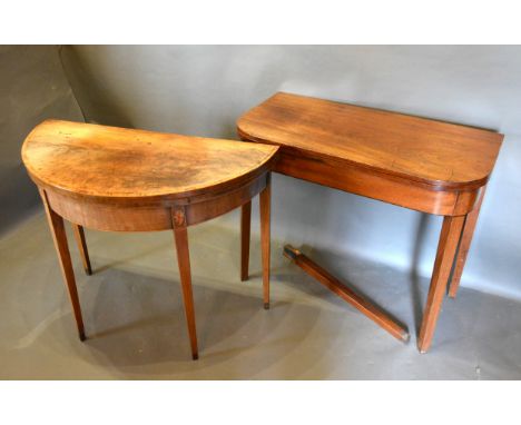 A 19th Century Mahogany Demi-Lune Card Table, the hinged top above a shell inlaid frieze raised upon square tapering legs tog