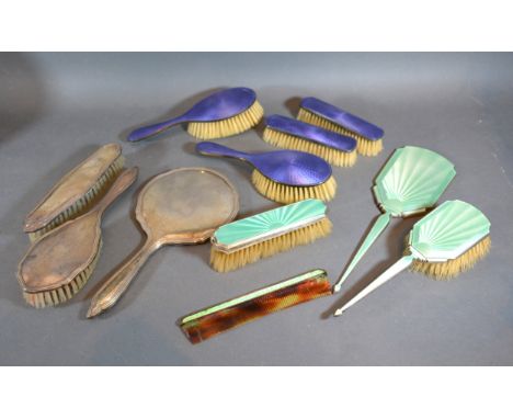 A Birmingham Silver and Enamel Decorated Four Piece Dressing Table Set together with a similar Birmingham silver and enamel d