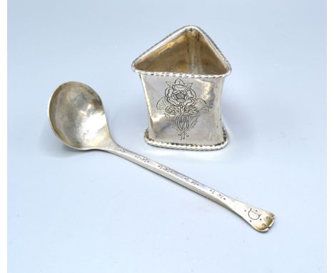 An Arts And Crafts Silver Napkin Ring by Alwyn Carr, London 1919, 5.5cms long together with an Arts And Crafts ladle by Phili